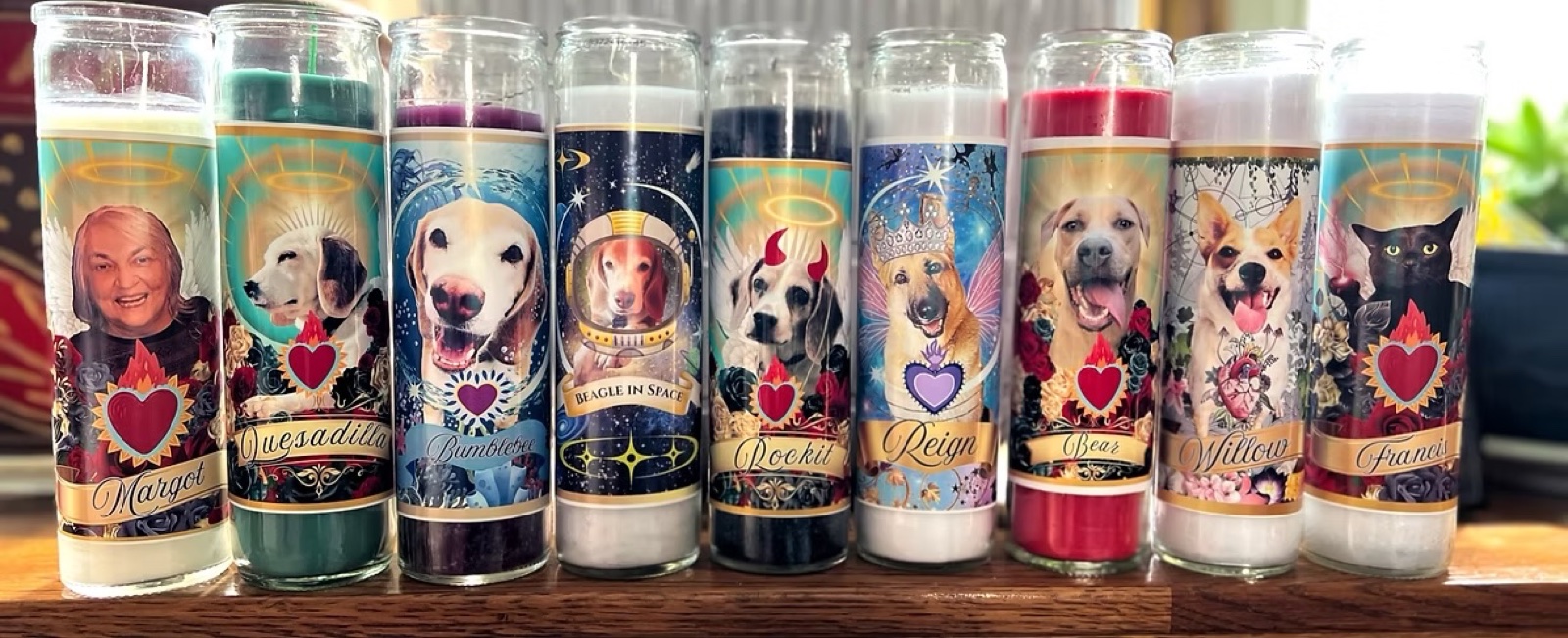 The Marcy Green devotional candle collection, lined up on the table